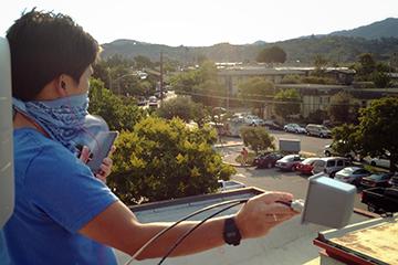 Vinh Pham (San Rafael) and David Cooper (Marin IT) test Wi-Fi signal strength at Pickleweed Library